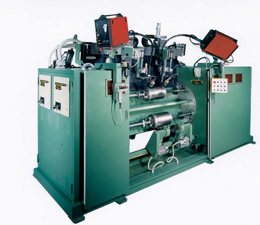 Lathe type welding machine equipped with dual weld heads with laser tracking